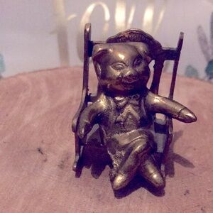 Miniature brass pig on chair , made in India